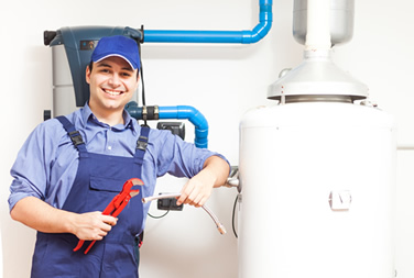 Plumbing contractor working on a hot water heater